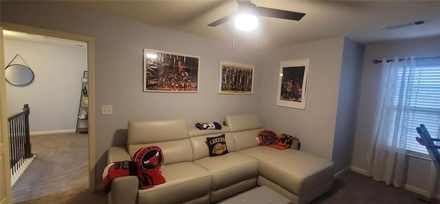 living room with ceiling fan, carpet floors, visible vents, and baseboards