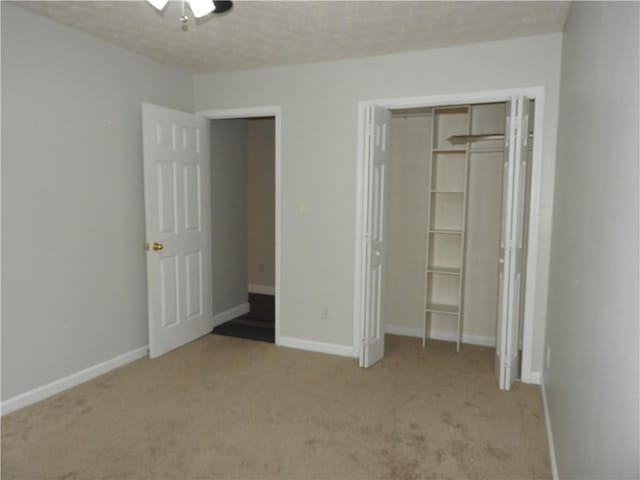 unfurnished bedroom with light colored carpet