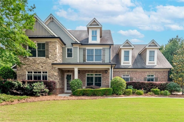 1771 Silvergrass Ln, Grayson, GA 30017 - craftsman inspired home with a front yard, stone siding, and brick siding