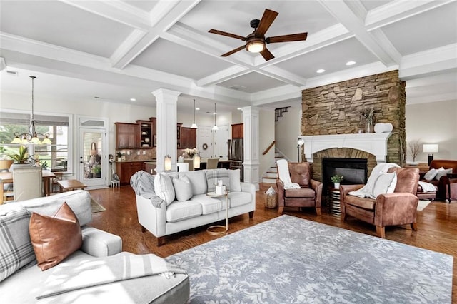 1771 Silvergrass Ln, Grayson, GA 30017 - living room with a ceiling fan, beamed ceiling, dark wood-style floors, a fireplace, and coffered ceiling