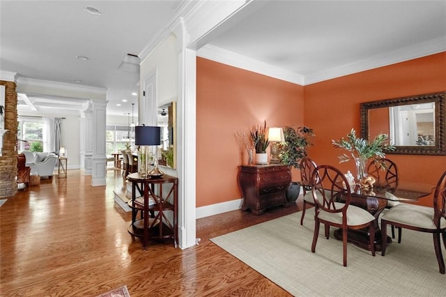 1771 Silvergrass Ln, Grayson, GA 30017 - dining area with ornate columns, crown molding, and wood finished floors