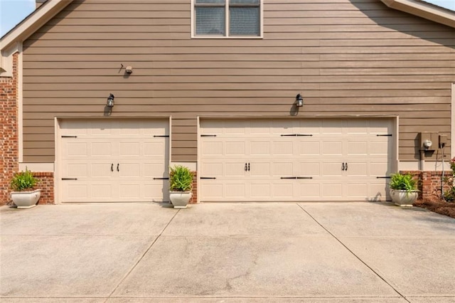 1771 Silvergrass Ln, Grayson, GA 30017 - garage with concrete driveway
