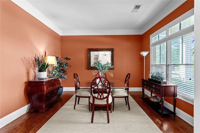 1771 Silvergrass Ln, Grayson, GA 30017 - dining space with ornamental molding and dark wood finished floors