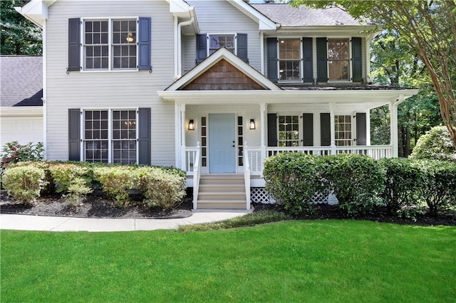 view of front of property featuring covered porch and a front lawn