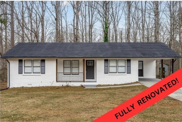 single story home featuring a carport, covered porch, and a front yard