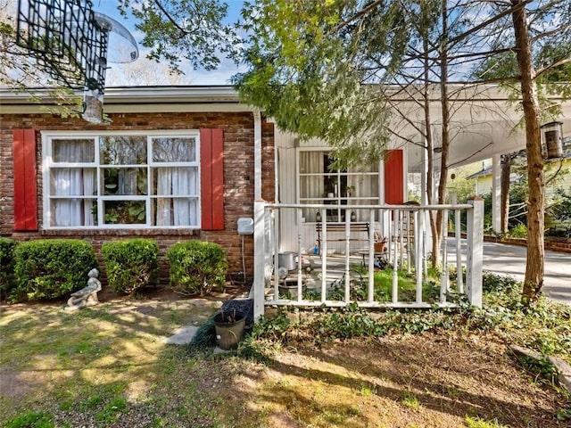 view of front of home with brick siding