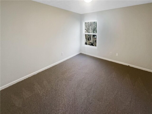 unfurnished living room with ceiling fan and carpet