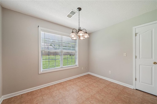 237 Raventree Ln, Griffin, GA 30224 - unfurnished room featuring a chandelier and a textured ceiling