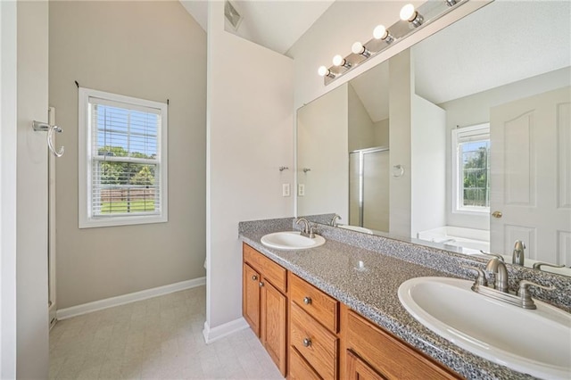237 Raventree Ln, Griffin, GA 30224 - bathroom featuring a stall shower, plenty of natural light, double vanity, and a garden tub