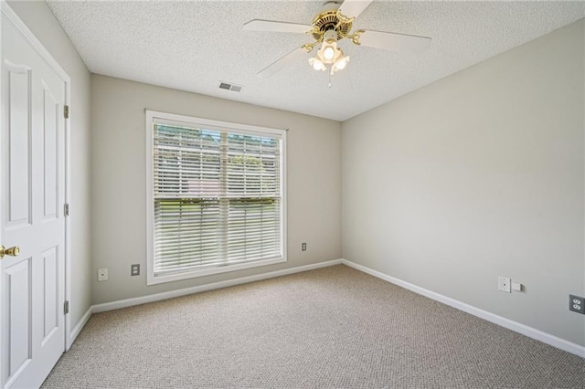 237 Raventree Ln, Griffin, GA 30224 - spare room with carpet floors, a textured ceiling, and a ceiling fan