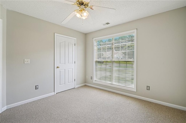 237 Raventree Ln, Griffin, GA 30224 - carpeted spare room featuring a textured ceiling and a ceiling fan