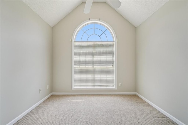 237 Raventree Ln, Griffin, GA 30224 - empty room featuring carpet flooring, lofted ceiling, and a ceiling fan