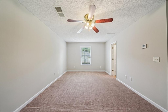 237 Raventree Ln, Griffin, GA 30224 - spare room with a textured ceiling, ceiling fan, and light carpet