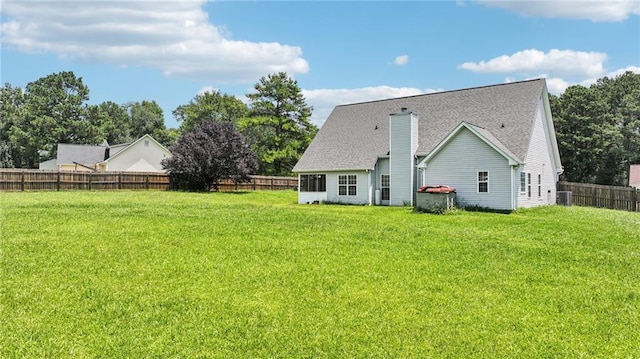 237 Raventree Ln, Griffin, GA 30224 - rear view of property with a chimney and a shingled roof