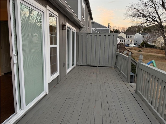 deck at dusk with a residential view