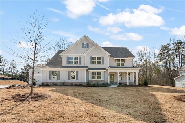 modern inspired farmhouse with covered porch and board and batten siding