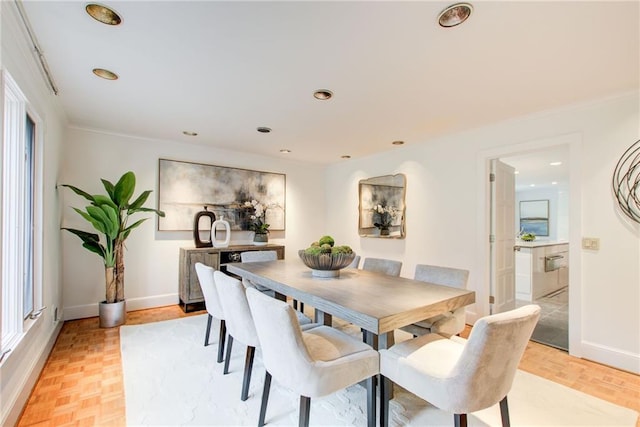 dining space featuring light parquet flooring