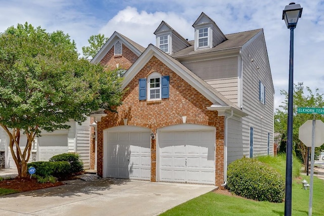 2421 Elkhorn Ter, Duluth, GA 30096 - traditional-style house with driveway, brick siding, and an attached garage