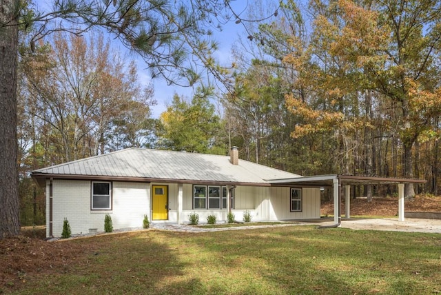 ranch-style house with a carport and a front yard