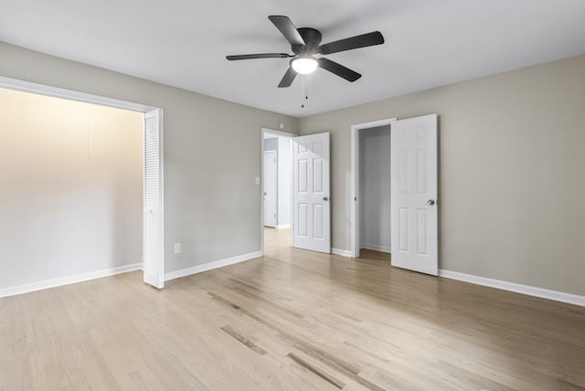 unfurnished bedroom featuring a closet, light hardwood / wood-style floors, and ceiling fan