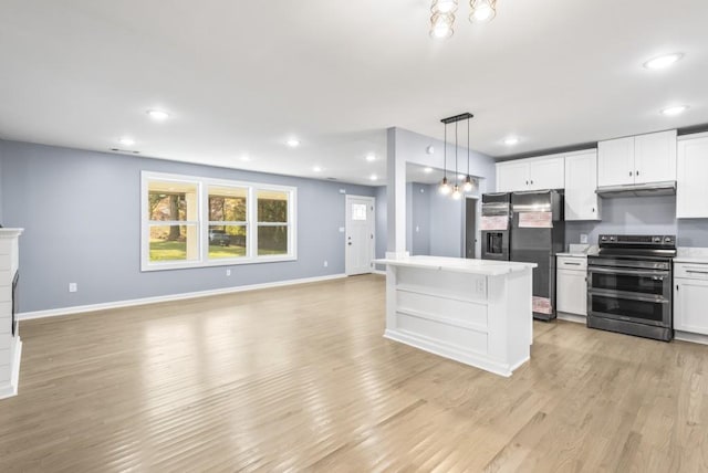 kitchen featuring stainless steel electric range, black refrigerator with ice dispenser, white cabinets, hanging light fixtures, and light hardwood / wood-style floors