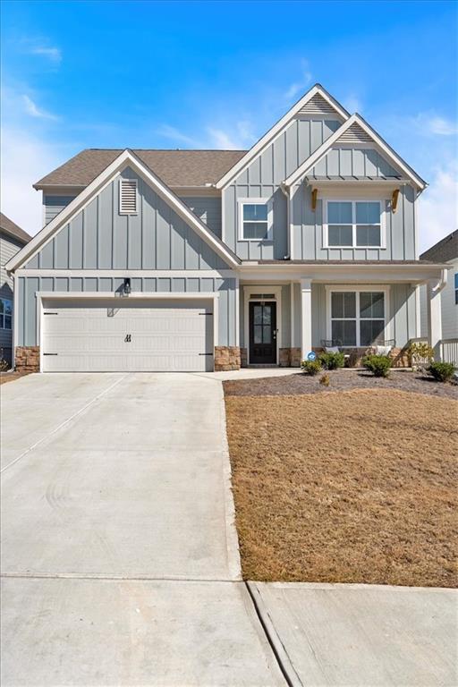 90 Citrine Way, Acworth, GA 30101 - view of front of property with a garage, board and batten siding, and concrete driveway