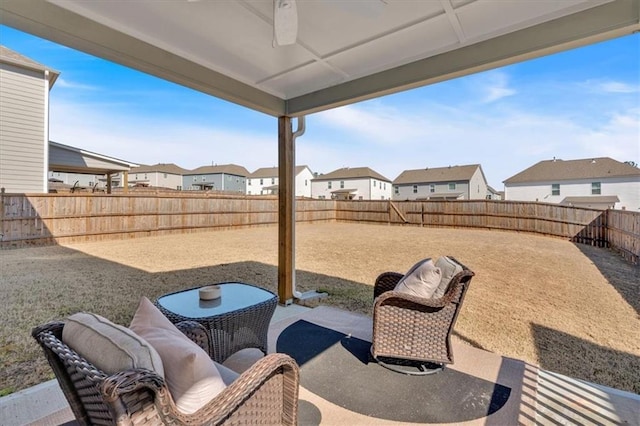 view of patio / terrace with a residential view and a fenced backyard