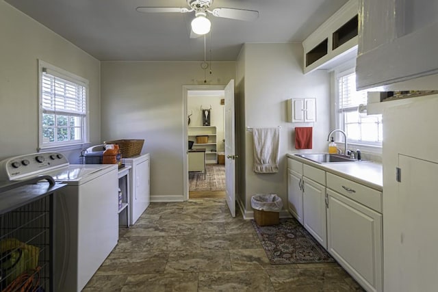 laundry room with sink, a wealth of natural light, washing machine and clothes dryer, and ceiling fan