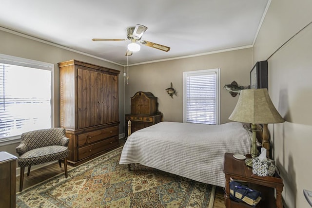 bedroom with ceiling fan, ornamental molding, and hardwood / wood-style floors