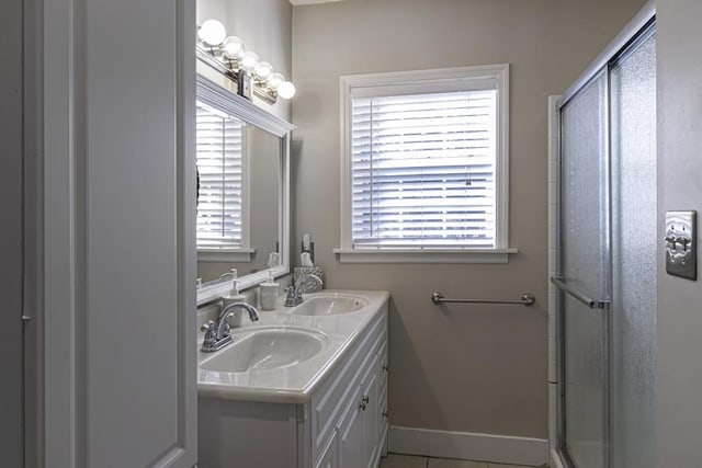 bathroom featuring vanity and a shower with shower door