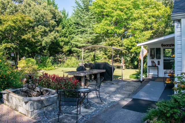 view of patio featuring a grill