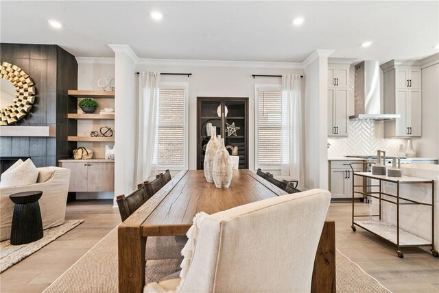 235 Briscoe Way Unit 7, Alpharetta, GA 30009 - dining area featuring light wood finished floors, recessed lighting, and crown molding