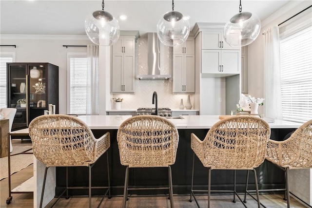 235 Briscoe Way Unit 7, Alpharetta, GA 30009 - kitchen with decorative backsplash, wall chimney exhaust hood, crown molding, and light countertops
