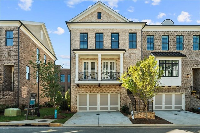 235 Briscoe Way Unit 7, Alpharetta, GA 30009 - multi unit property featuring a garage, brick siding, central AC unit, and concrete driveway