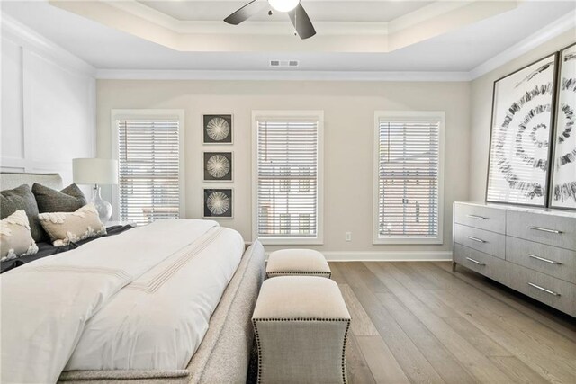 235 Briscoe Way Unit 7, Alpharetta, GA 30009 - bedroom featuring a raised ceiling, crown molding, and visible vents