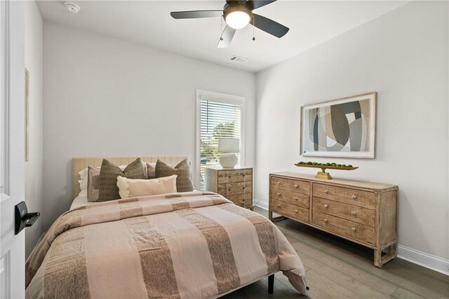235 Briscoe Way Unit 7, Alpharetta, GA 30009 - bedroom with visible vents, baseboards, wood finished floors, and a ceiling fan