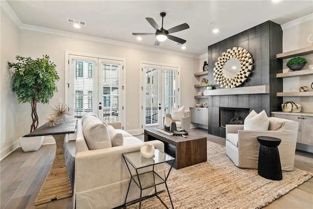 235 Briscoe Way Unit 7, Alpharetta, GA 30009 - living room with visible vents, crown molding, french doors, wood finished floors, and a ceiling fan