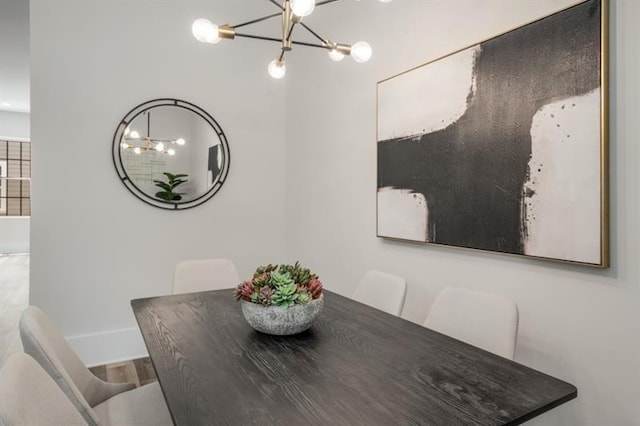 dining space featuring a chandelier