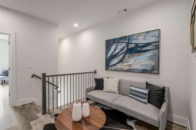 sitting room with hardwood / wood-style floors