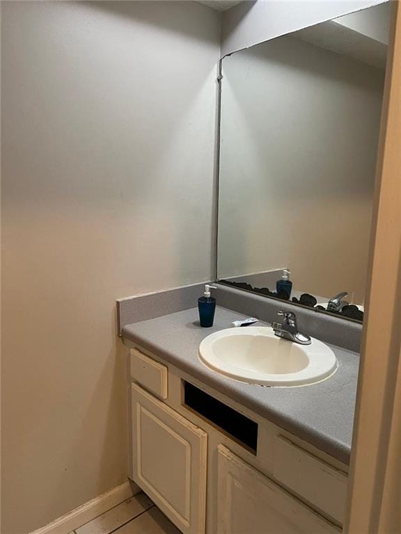 bathroom with vanity and tile patterned floors