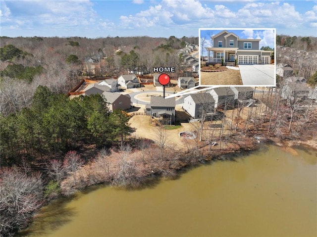 birds eye view of property featuring a water view