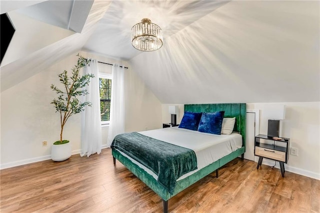 1471 Hardin Dr, College Park, GA 30337 - bedroom with wood finished floors, a chandelier, and lofted ceiling