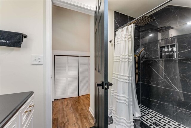 1471 Hardin Dr, College Park, GA 30337 - bathroom featuring a marble finish shower, vanity, wood finished floors, and a closet