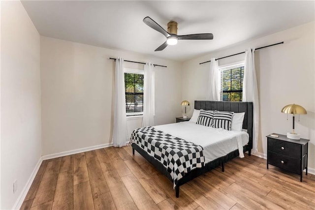 1471 Hardin Dr, College Park, GA 30337 - bedroom featuring multiple windows, light wood finished floors, and ceiling fan