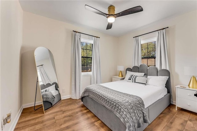 1471 Hardin Dr, College Park, GA 30337 - bedroom with wood finished floors, arched walkways, and a ceiling fan