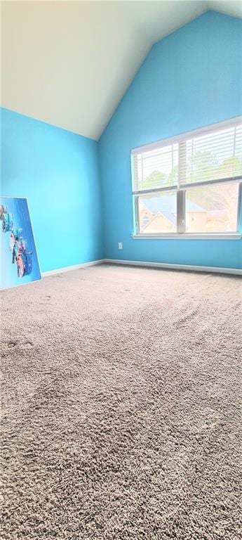 bonus room featuring lofted ceiling and carpet