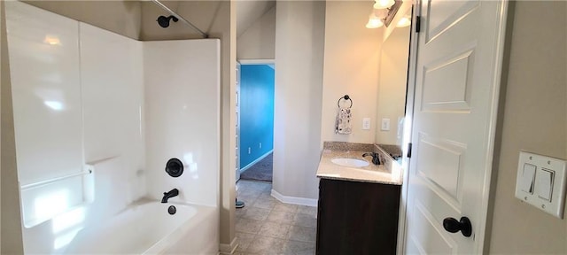 bathroom with washtub / shower combination and vanity