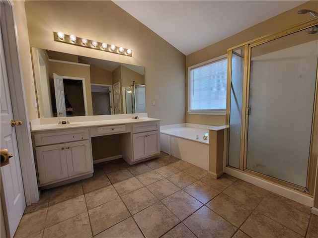 bathroom with lofted ceiling, vanity, tile patterned flooring, and separate shower and tub