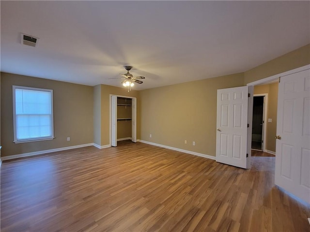 spare room with ceiling fan and light hardwood / wood-style flooring