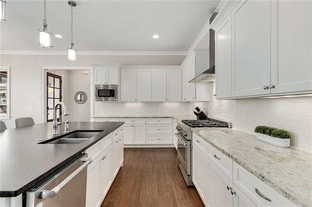 kitchen with a sink, ornamental molding, white cabinetry, and stainless steel appliances